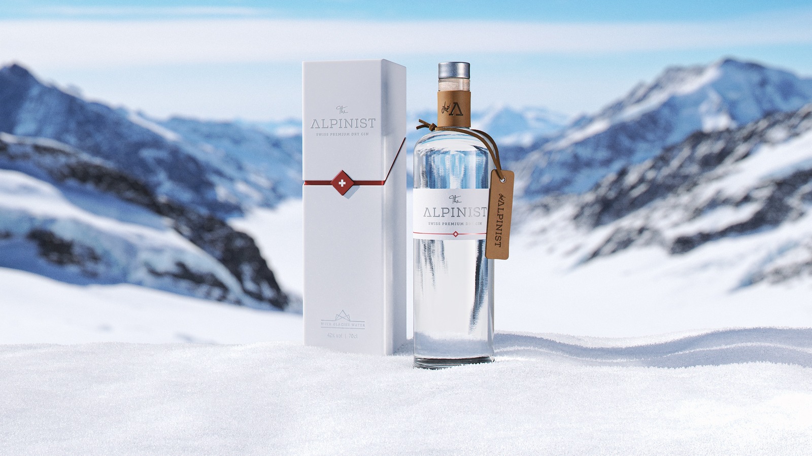 The Alpinist Gin und Verpackung im Schnee vor Bergpanorama