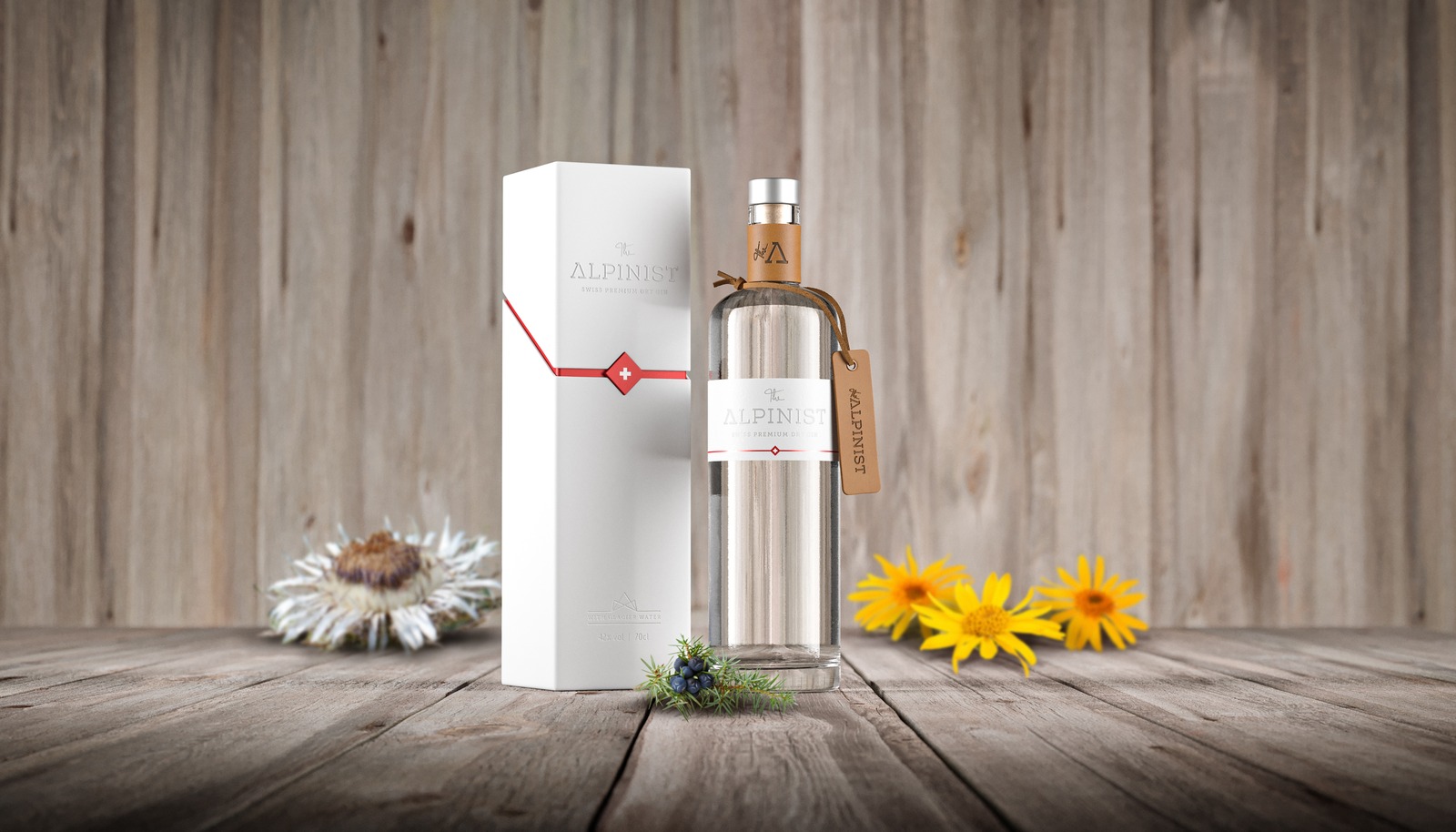 The Alpinist Gin Flasche und Verpackung auf Holz mit Blumen