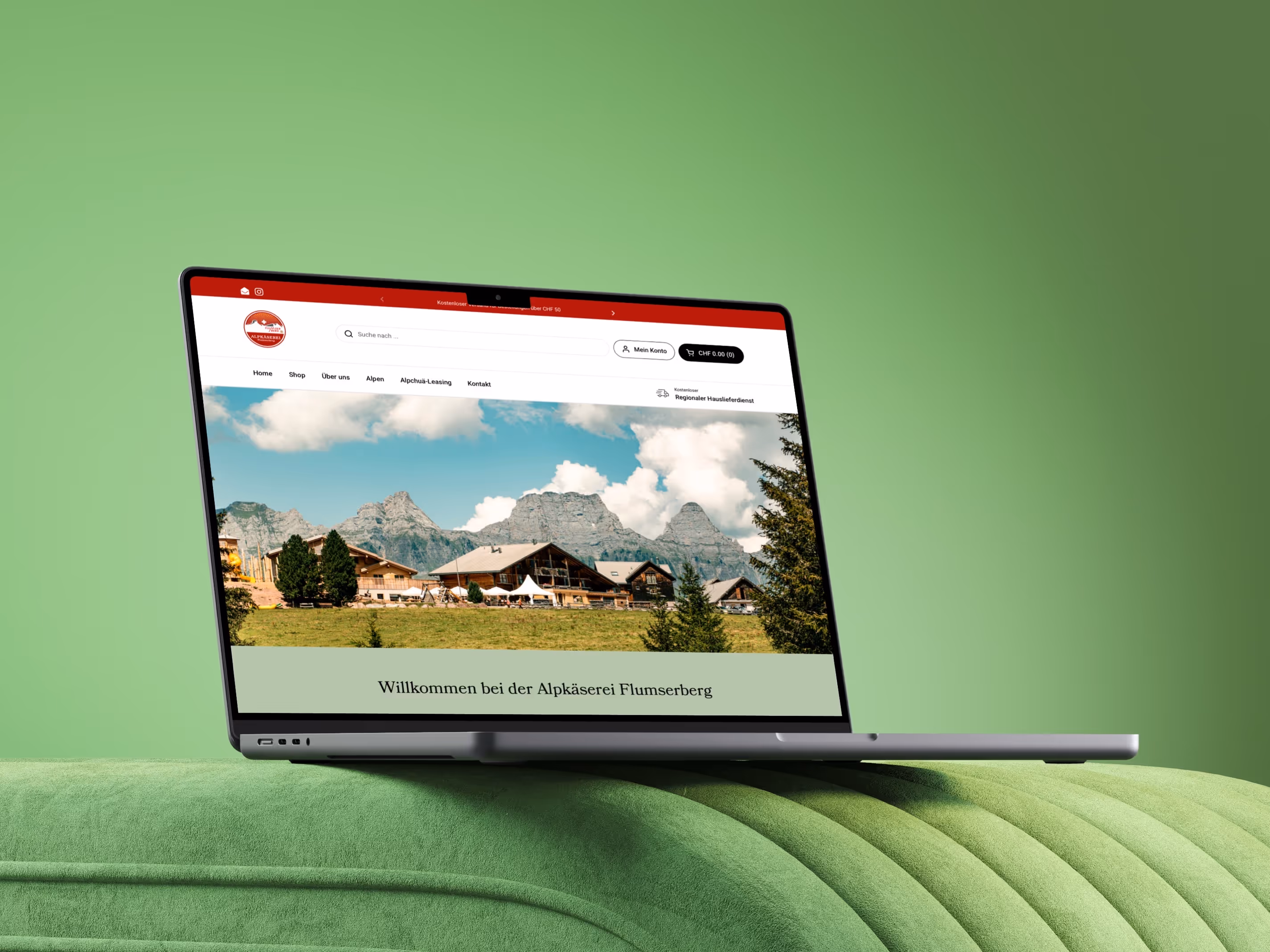 Alpkäserei Flumserberg Website auf einem Laptop vor grünem Hintergrund